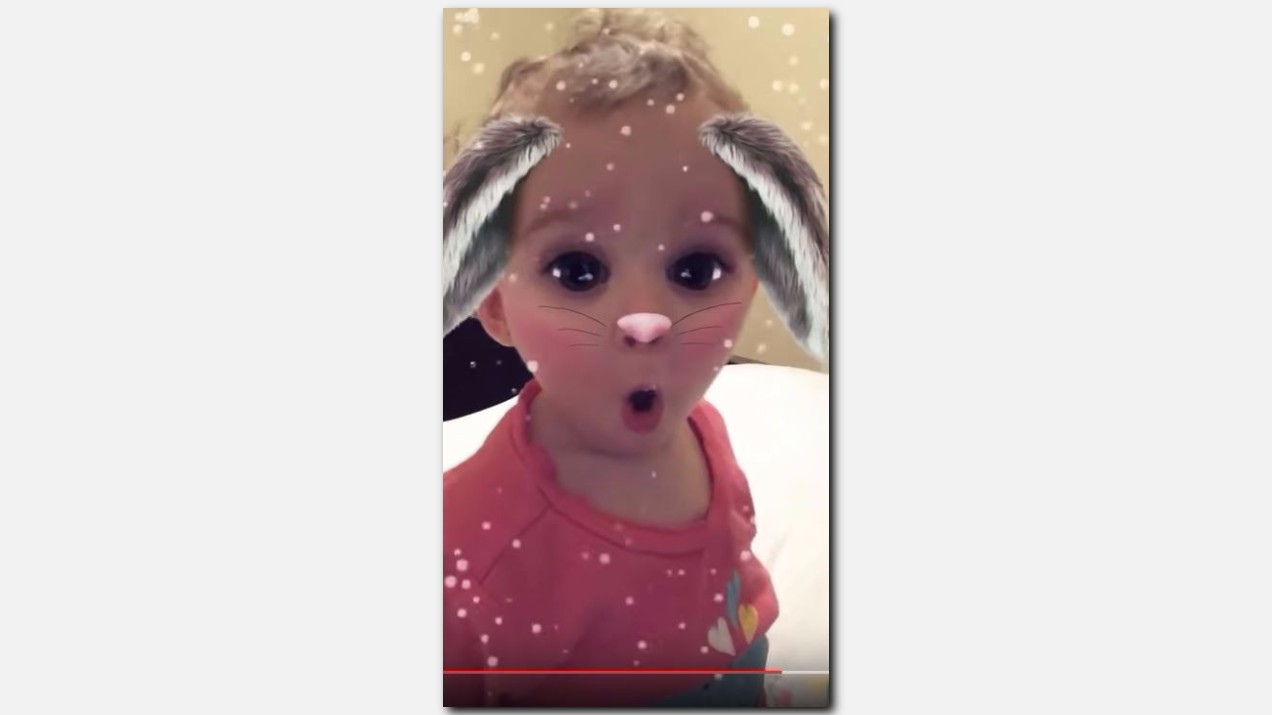 Crying baby calmed down by Snapchat's bunny filter